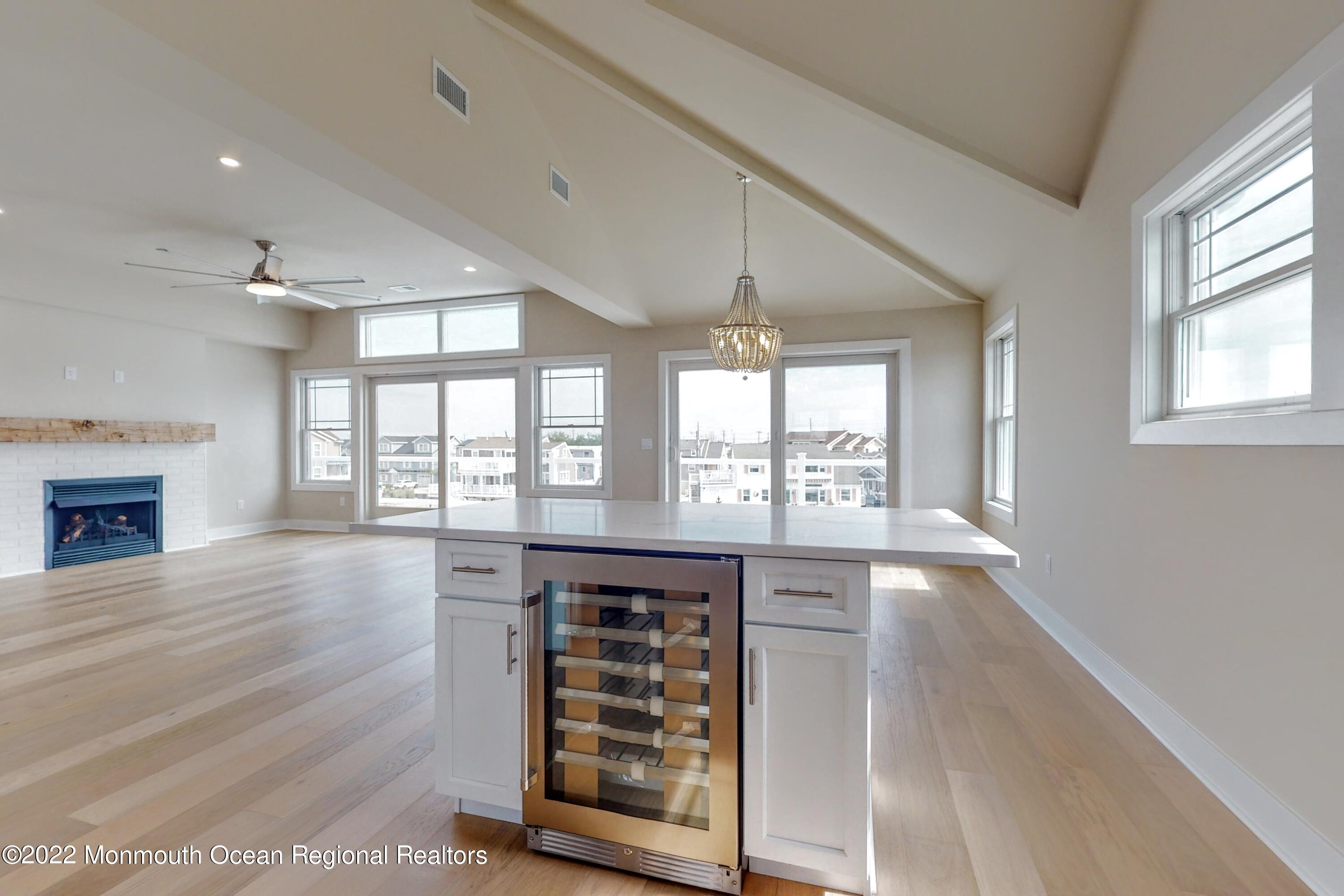 48 Muriel Drive Manahawkin, NJ 08050 - Photo 24 of 89 a view of an empty room with wooden floor and a window