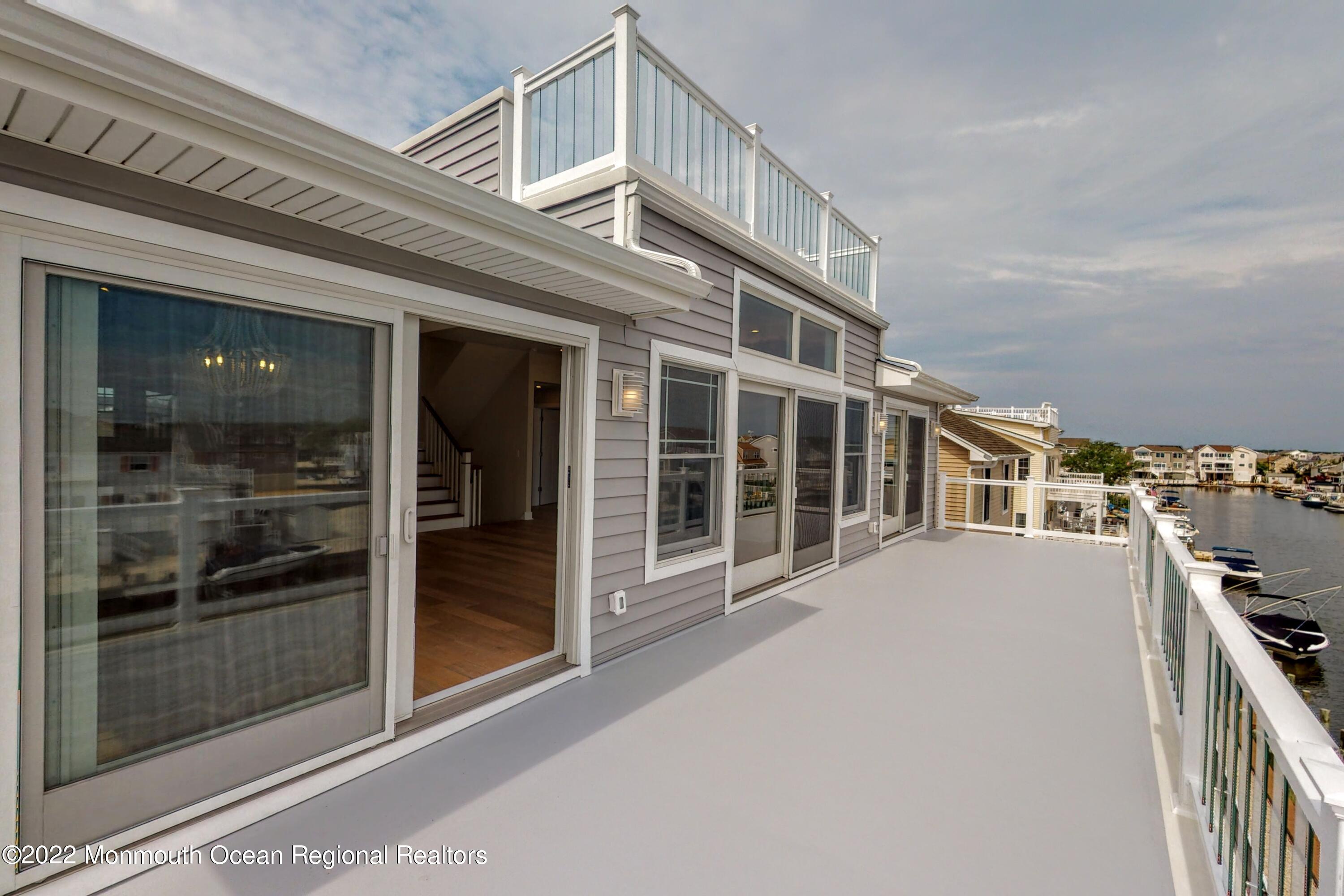48 Muriel Drive Manahawkin, NJ 08050 - Photo 36 of 89 a view of a building with glass windows and door