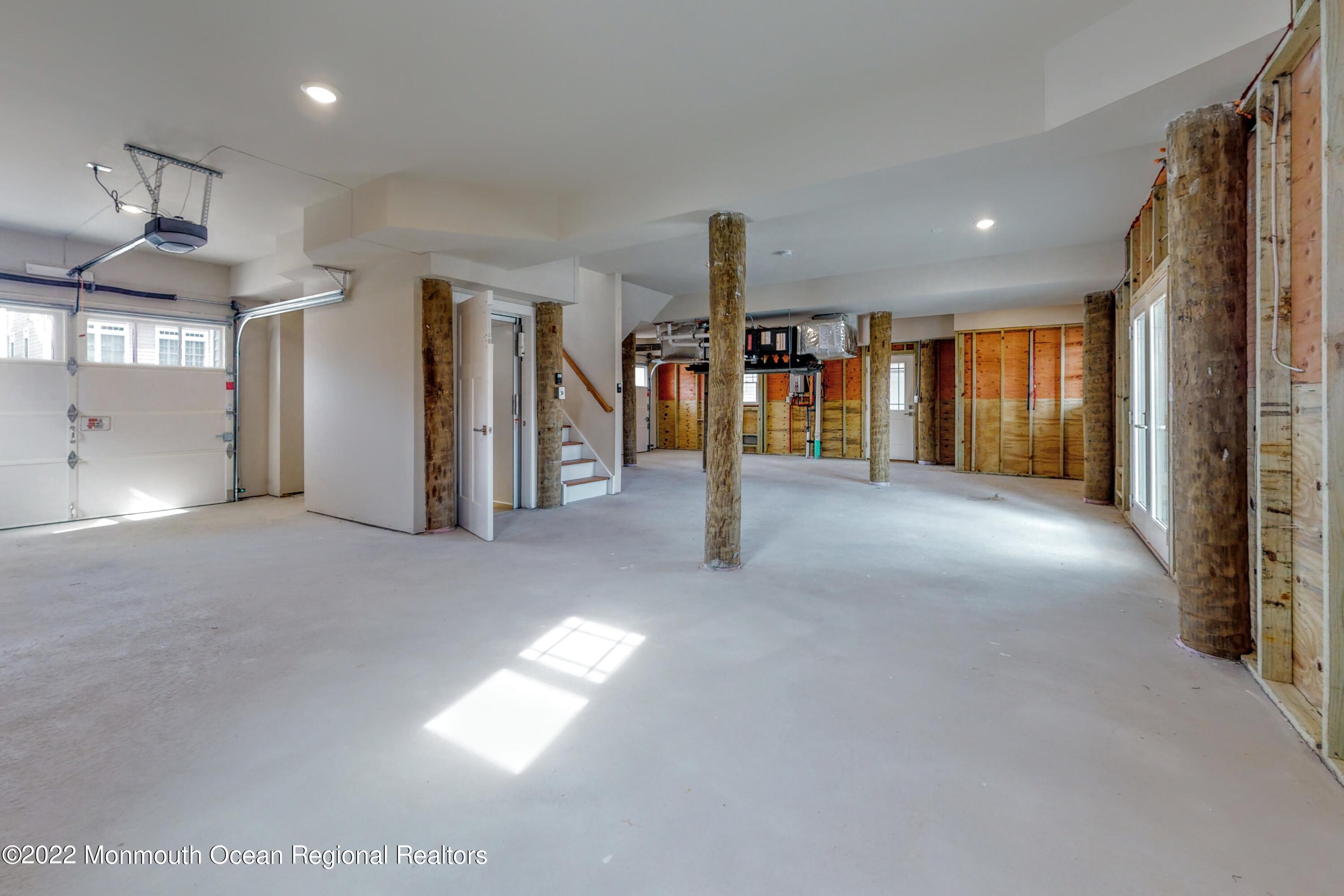 48 Muriel Drive Manahawkin, NJ 08050 - Photo 60 of 89 a view of a hallway with a tv