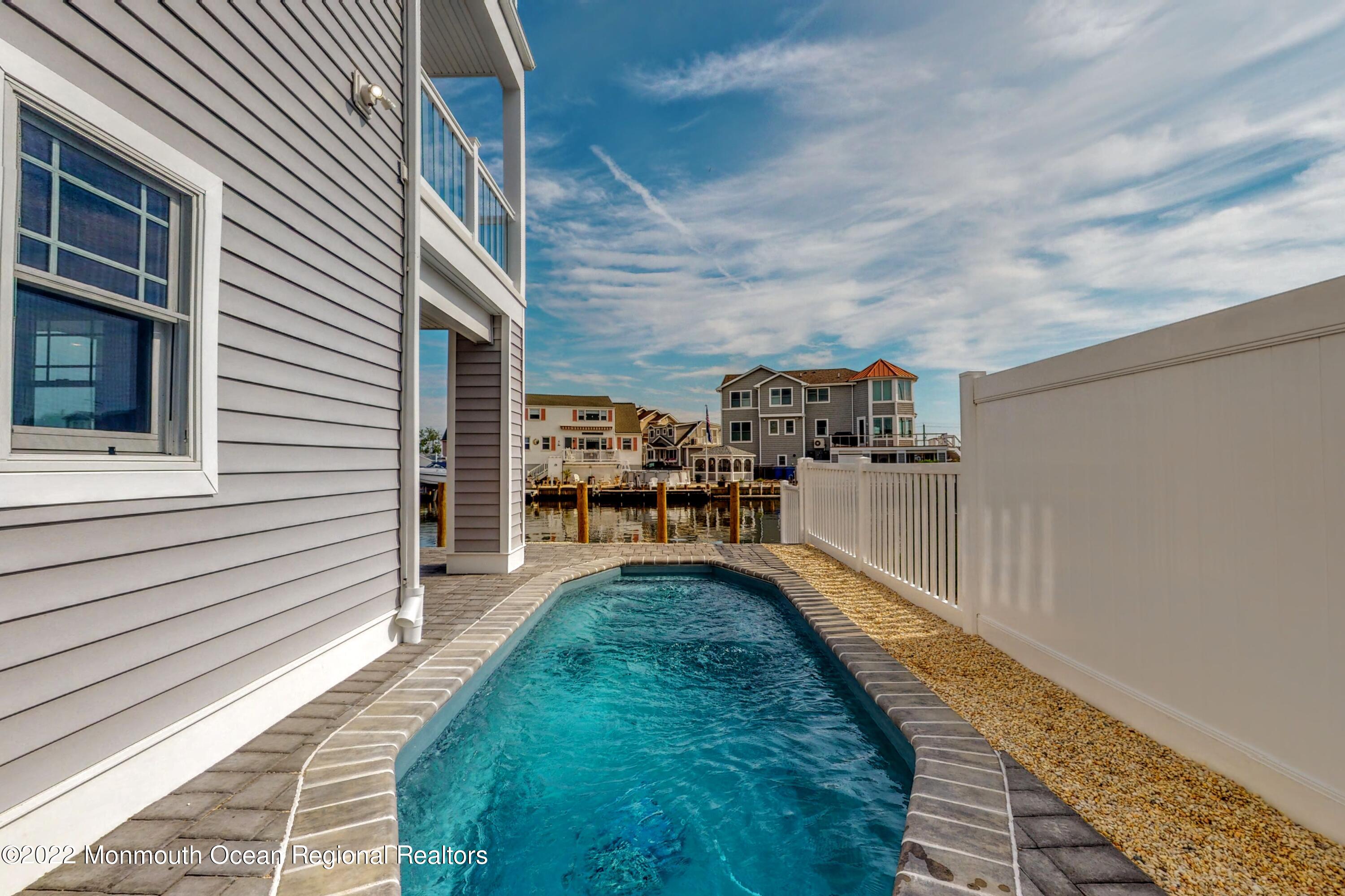 48 Muriel Drive Manahawkin, NJ 08050 - Photo 64 of 89 a view of a backyard with sitting area