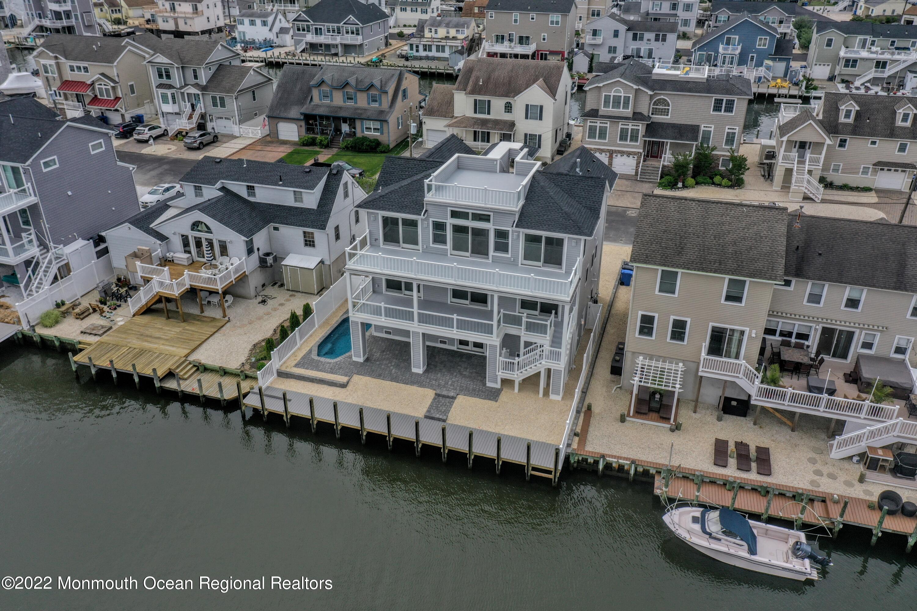 48 Muriel Drive Manahawkin, NJ 08050 - Photo 83 of 89 an aerial view of residential houses with outdoor space and lake view