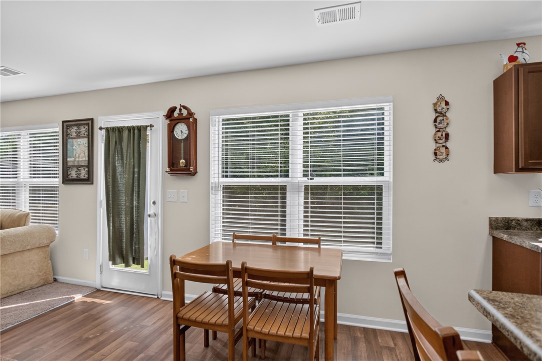 1081 Edenbrooke Circle Anderson, SC 29621 - Photo 14 of 46 An inviting kitchen space features ample windows and durable wood flooring.