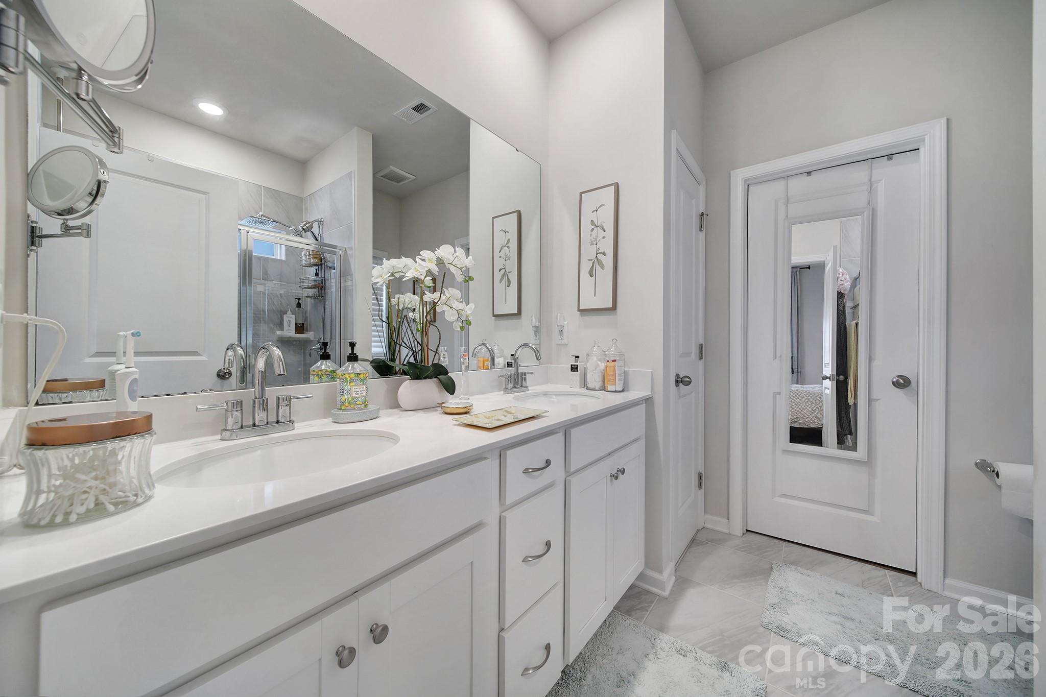 6521 Gopher Road Lancaster, SC 29720 - Photo 23 of 45 a spacious bathroom with a double vanity sink and a mirror