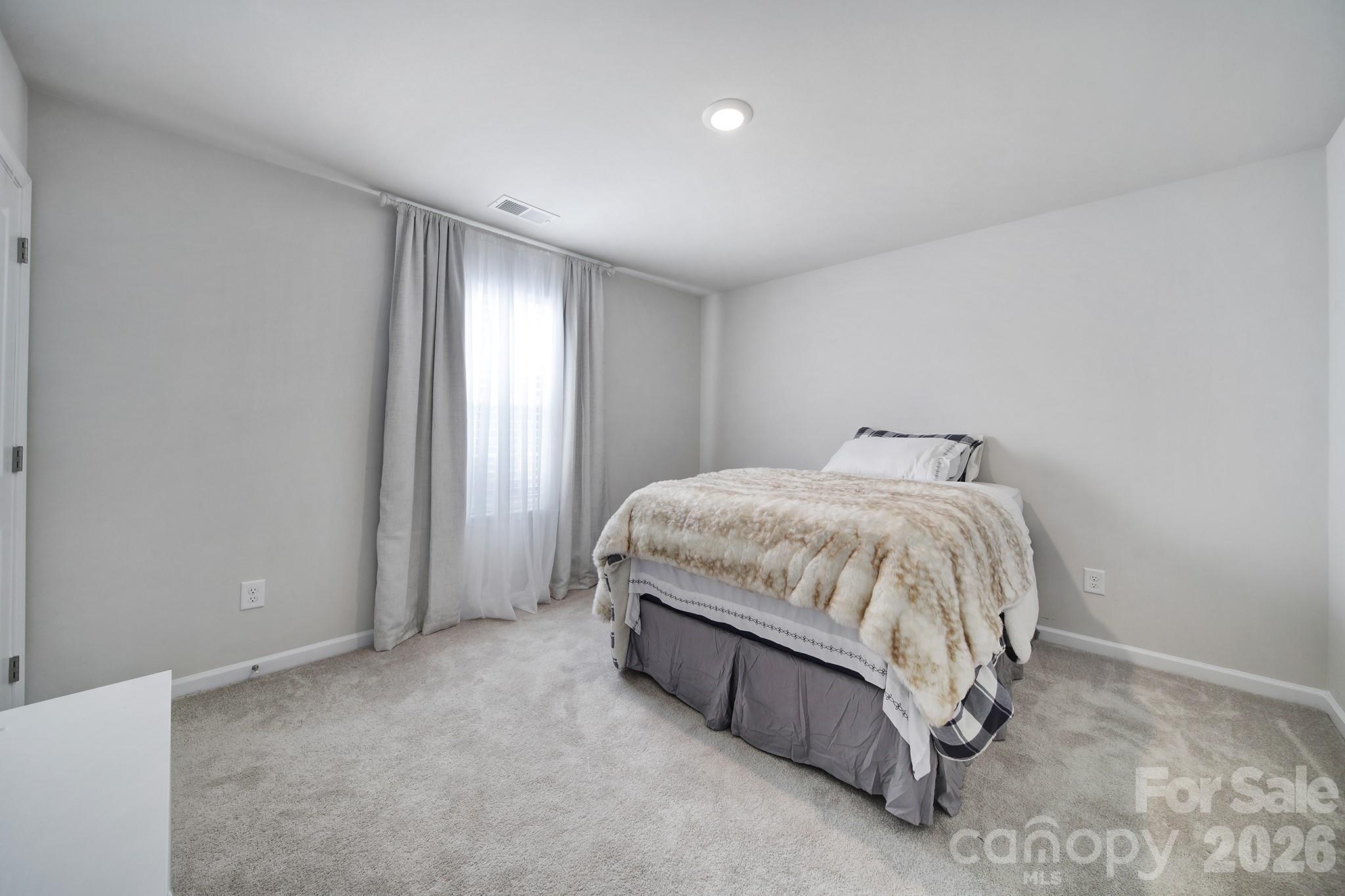 6521 Gopher Road Lancaster, SC 29720 - Photo 26 of 45 a bedroom with a bed and a window