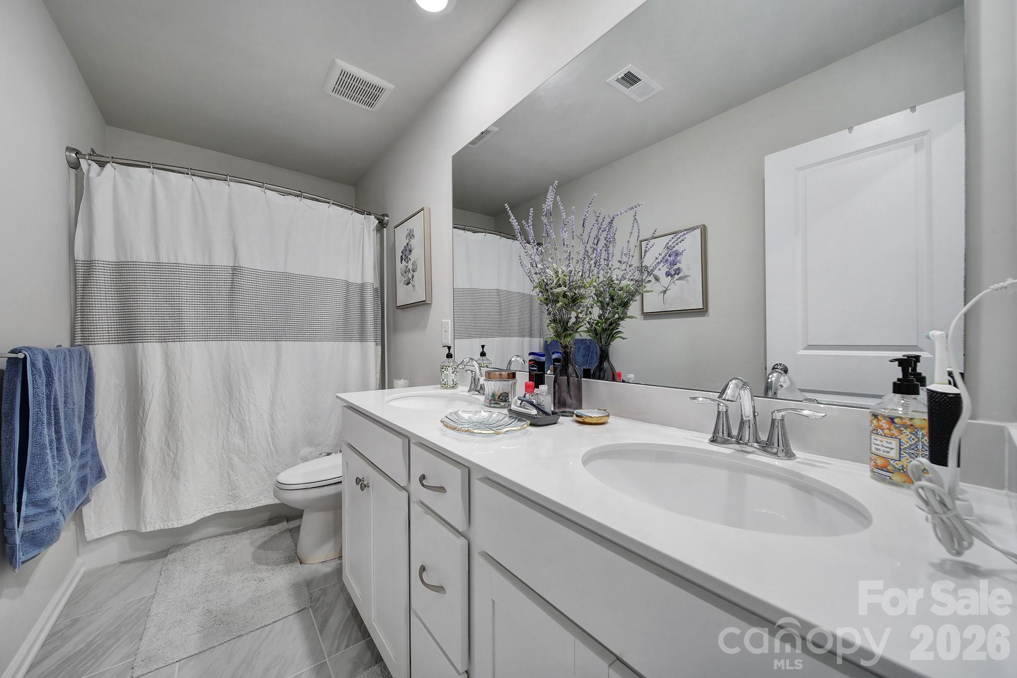6521 Gopher Road Lancaster, SC 29720 - Photo 28 of 45 a bathroom with a sink double vanity and a mirror