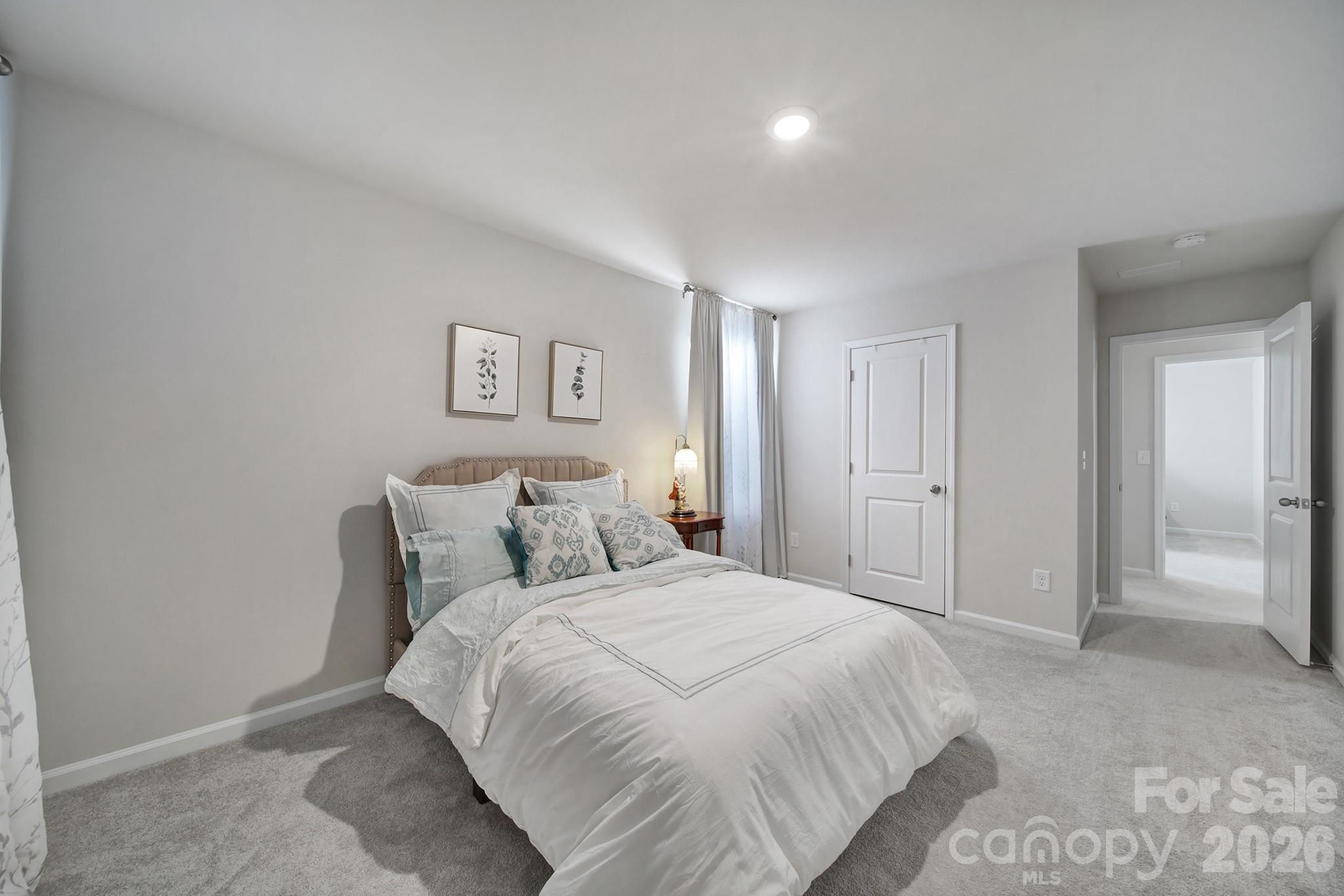 6521 Gopher Road Lancaster, SC 29720 - Photo 29 of 45 a bedroom with a bed and a walk in closet