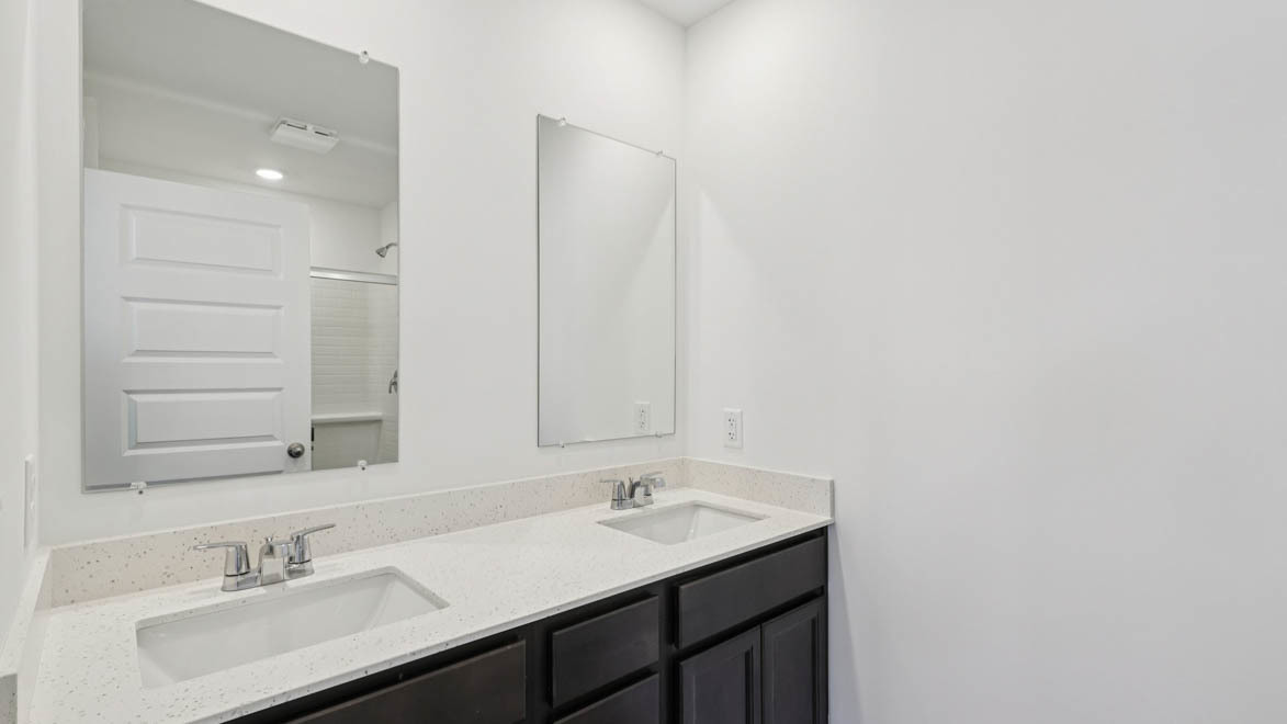 585 Yosemite Way Mundelein, IL 60060 - Photo 12 of 54 a bathroom with a sink and a mirror