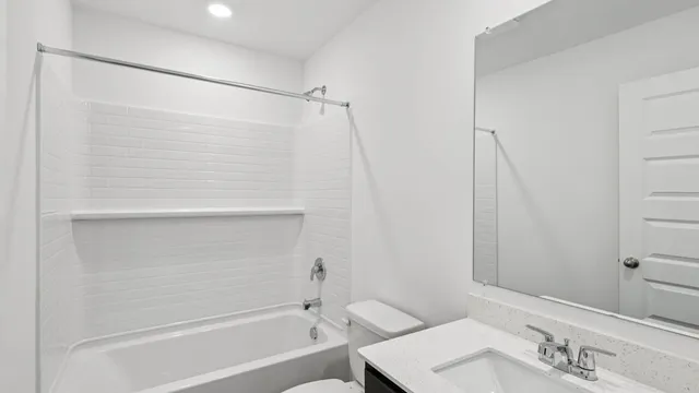 a bathroom with a shower and a sink