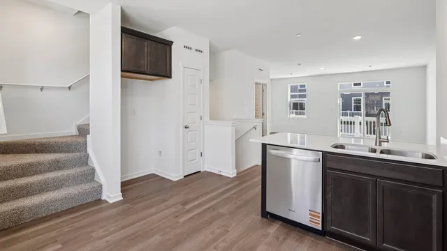 a kitchen with a sink and refrigerator