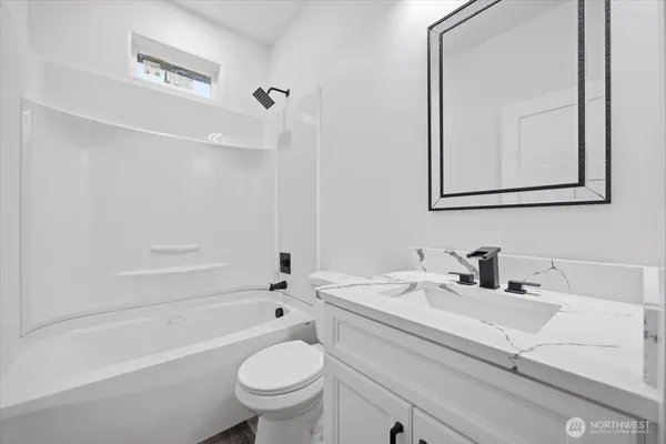 a bathroom with a sink a toilet and a bathtub
