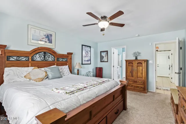 a bedroom with a bed and a dresser