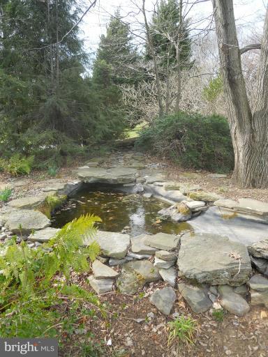 7820 Chapman Road Kingsville, MD 21087 - Photo 6 of 30 Pond w/ Waterfall Viewable from Sunroom