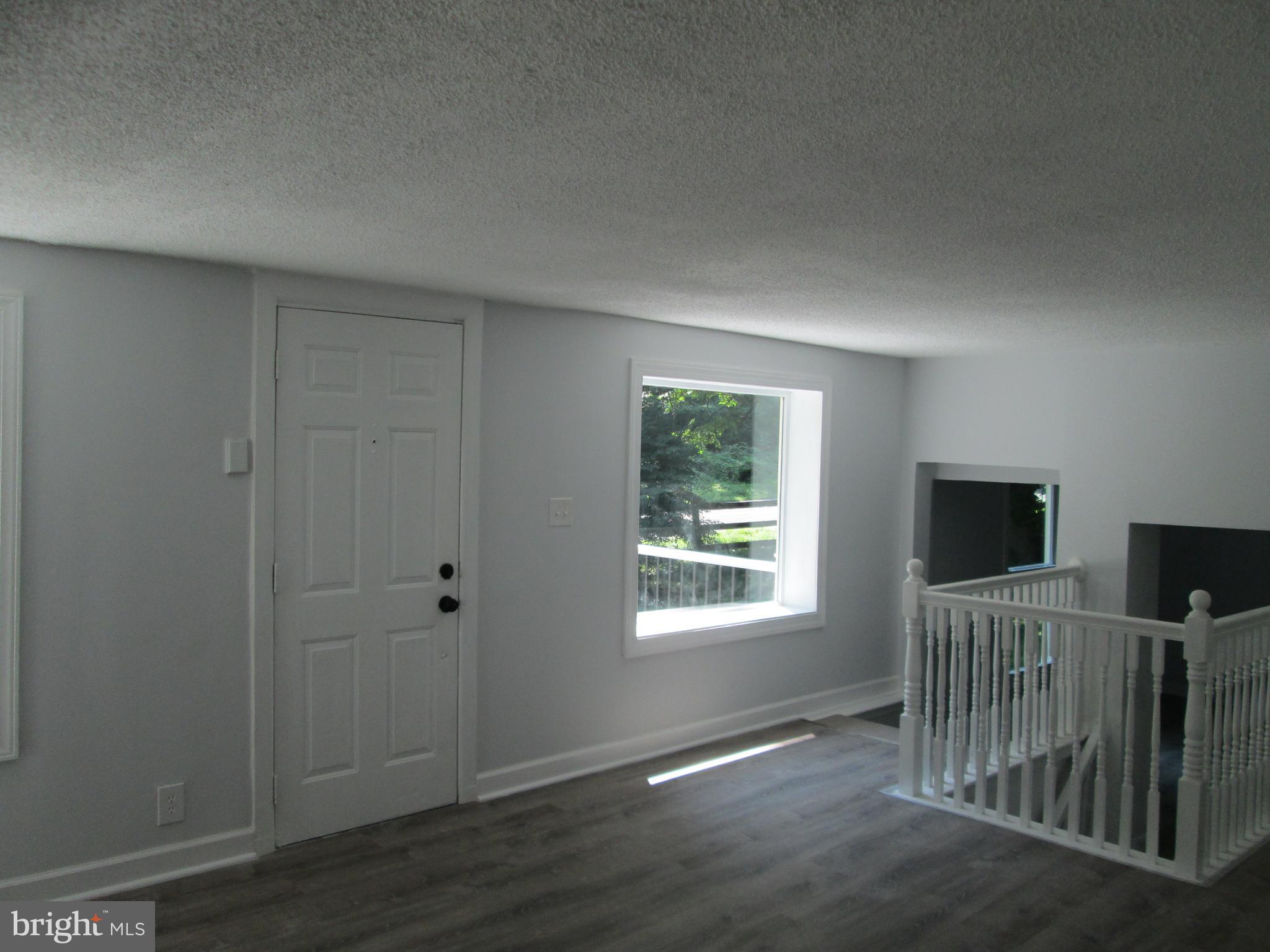 3508 New Design Road Frederick, MD 21703 - Photo 9 of 26 Living Room With LifeProof Vinyl Plank Flooring