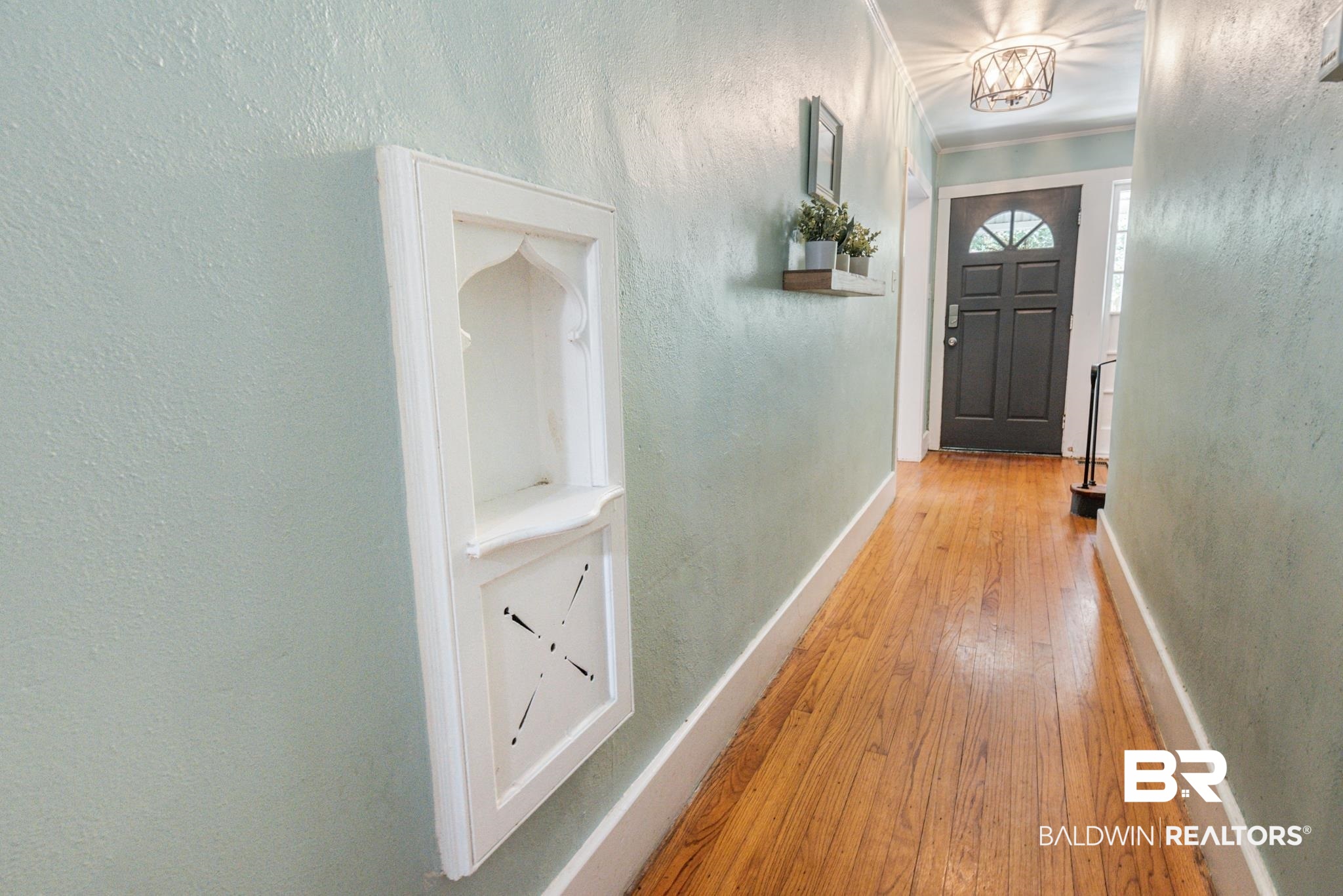 114 Crenshaw Street Mobile, AL 36606 - Photo 9 of 49 Doorway with light hardwood / wood-style floors and ornamental molding