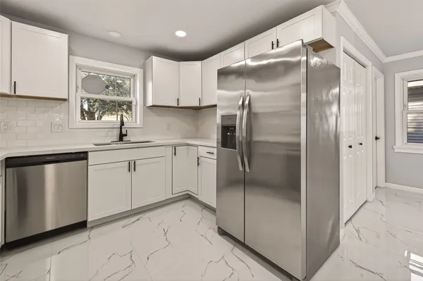 a kitchen with a stove and a microwave