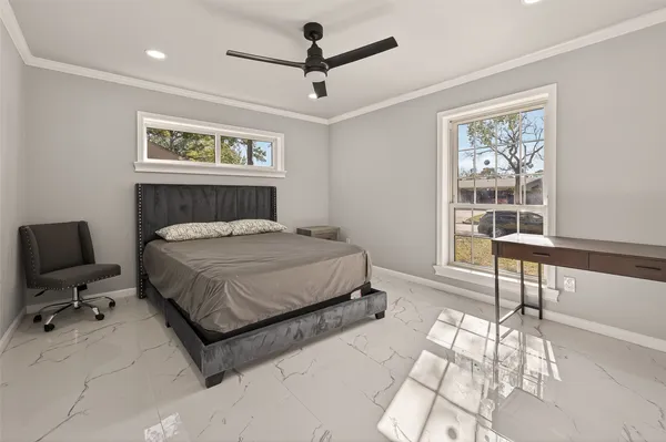 a bedroom with a bed and a table