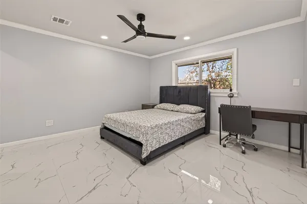 a bathroom with a granite countertop sink a toilet and a mirror