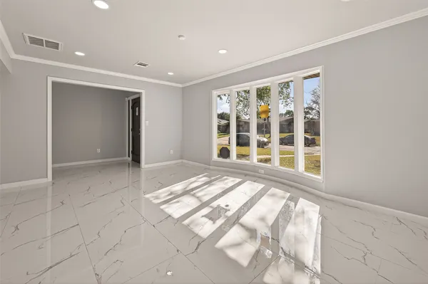 a view of a hallway with windows