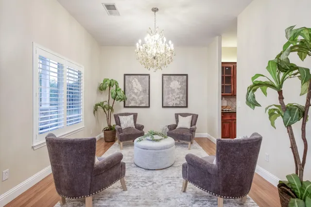 a kitchen with kitchen island granite countertop wooden cabinets stainless steel appliances a sink and a center island