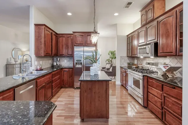 a kitchen with a stove and a sink