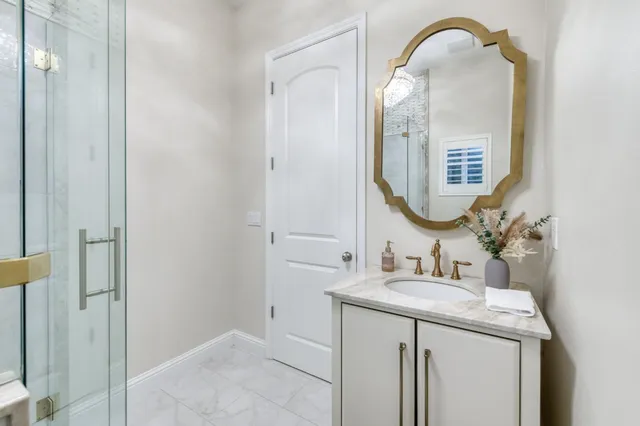 a front view of a house with porch and furniture