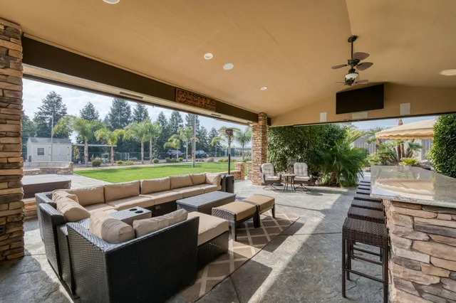 a front view of a house with a yard table and chairs