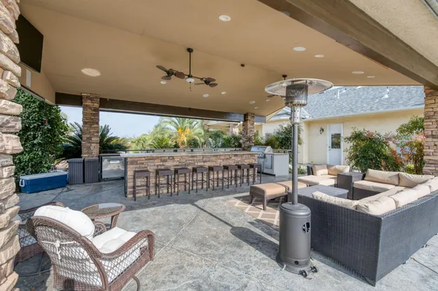 a outdoor space with lots of furniture and a rug