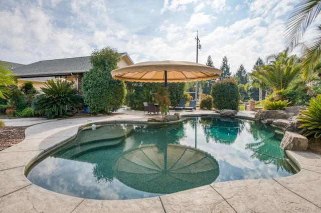 a living room with furniture and a kitchen view