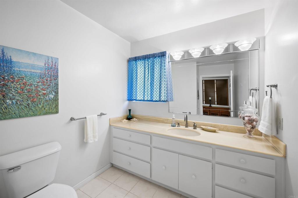 846 Val Sereno Drive Encinitas, CA 92024 - Photo 11 of 43 a bathroom with a double vanity sink mirror and toilet
