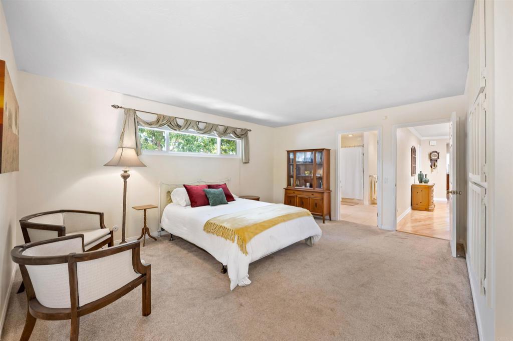 846 Val Sereno Drive Encinitas, CA 92024 - Photo 14 of 43 a bedroom with a bed and a chair