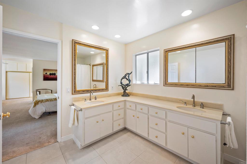 846 Val Sereno Drive Encinitas, CA 92024 - Photo 16 of 43 a spacious bathroom with a double vanity sink a mirror and a bathtub