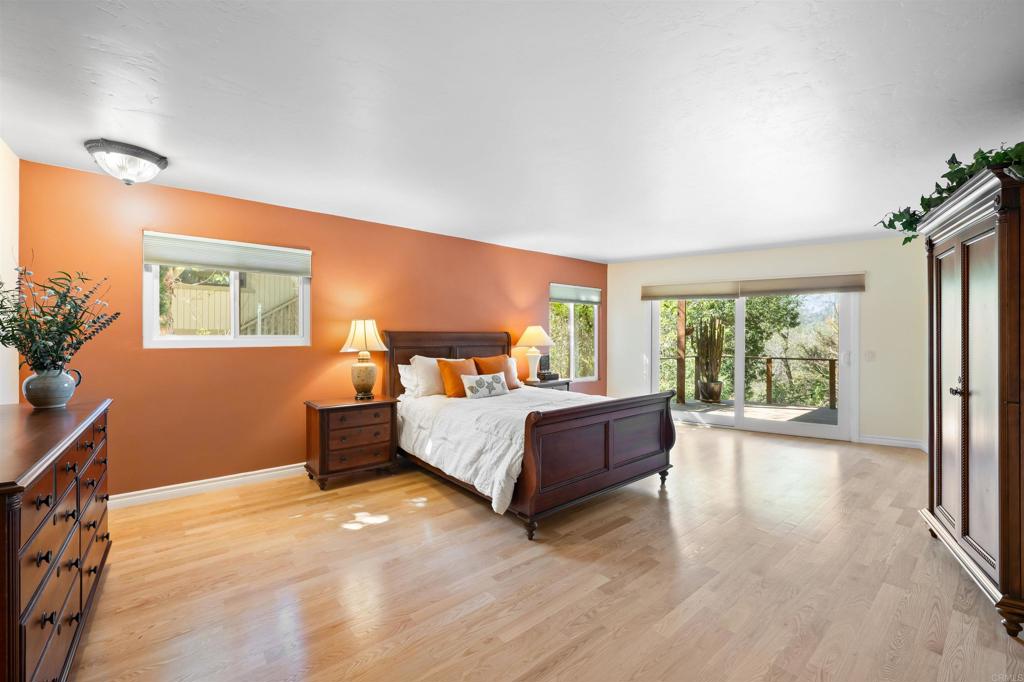 846 Val Sereno Drive Encinitas, CA 92024 - Photo 21 of 43 a bed room with a bed and a couch
