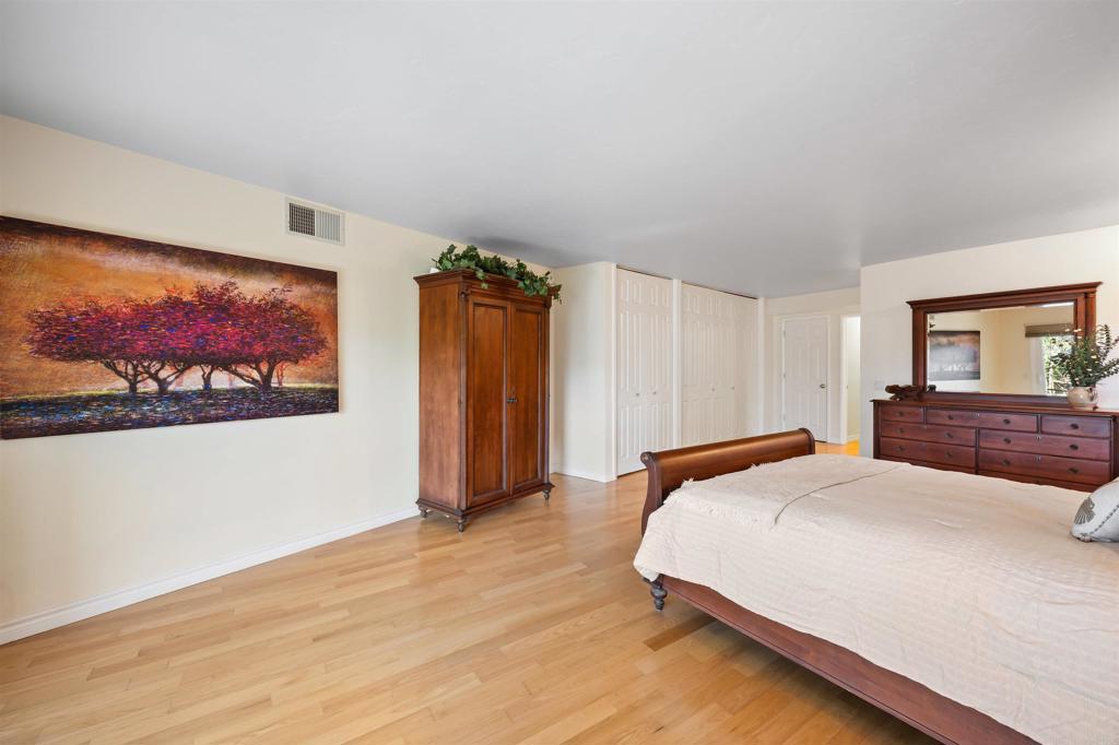 846 Val Sereno Drive Encinitas, CA 92024 - Photo 22 of 43 a bedroom with a bed and a flat screen tv