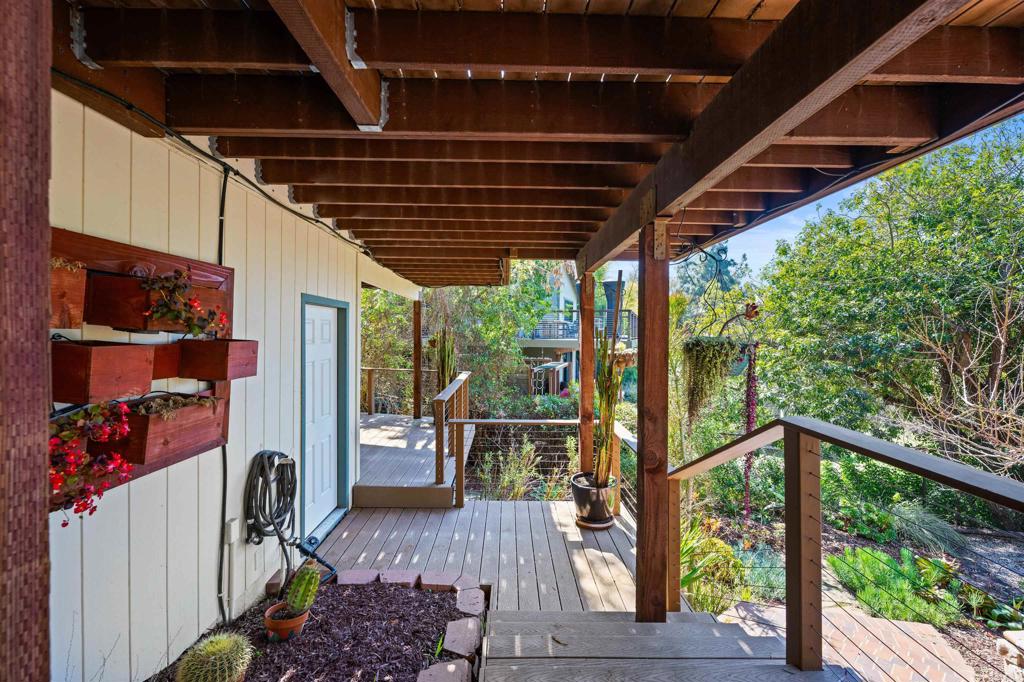 846 Val Sereno Drive Encinitas, CA 92024 - Photo 28 of 43 a view of a porch with wooden floor and iron stairs
