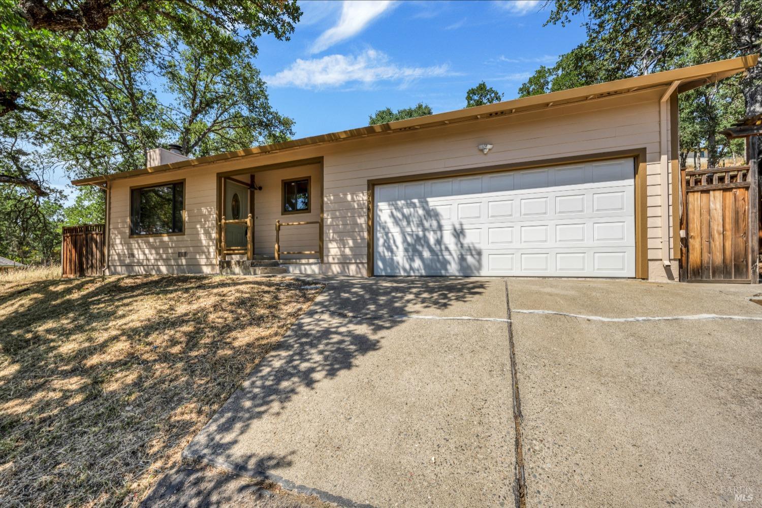 19202 Hidden Valley Road Hidden Valley Lake, CA 95467 - Photo 1 of 1 a front view of a house with yard