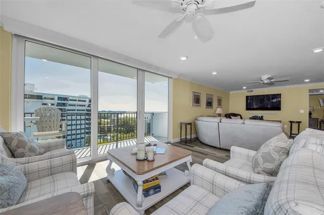 a spacious bedroom with a bed a couch and cabinet