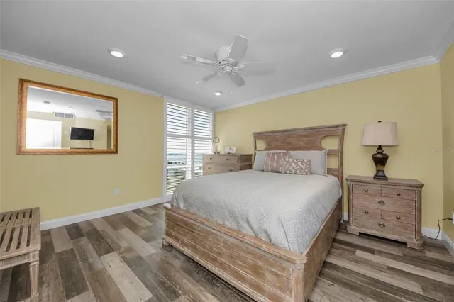 a bathroom with a granite countertop sink a toilet and mirror