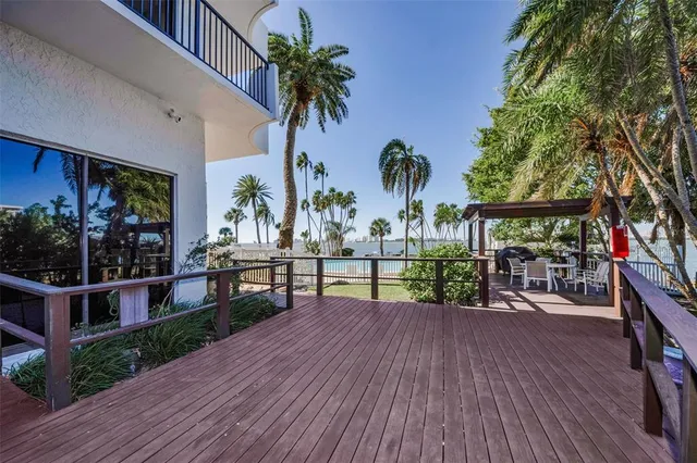 an aerial view of a house with a lake view