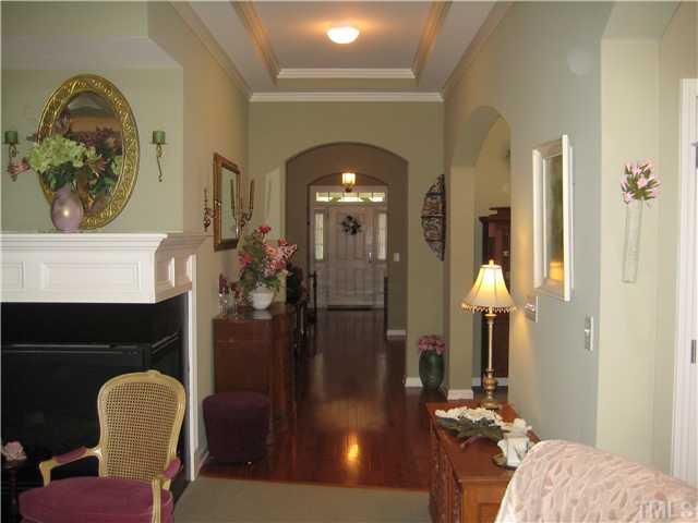 6213 Oconner Street Raleigh, NC 27617 - Photo 11 of 15 a living room with furniture and a chandelier
