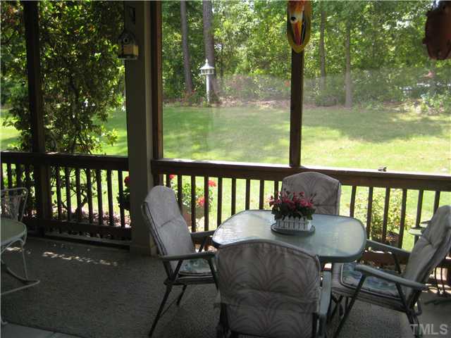 6213 Oconner Street Raleigh, NC 27617 - Photo 13 of 15 a view of a balcony with a table and chairs