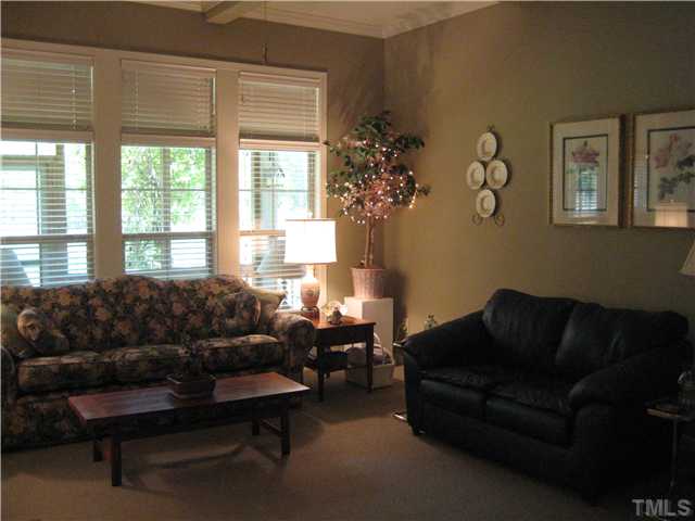 6213 Oconner Street Raleigh, NC 27617 - Photo 5 of 15 a living room with furniture and a large window