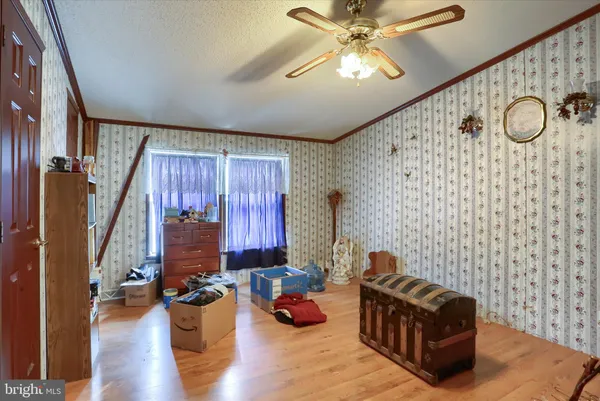 a view of a livingroom with furniture and a chandelier