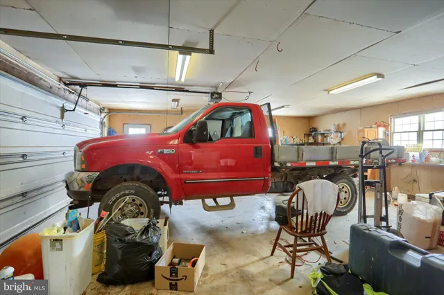 a view of a house with a yard covered in snow