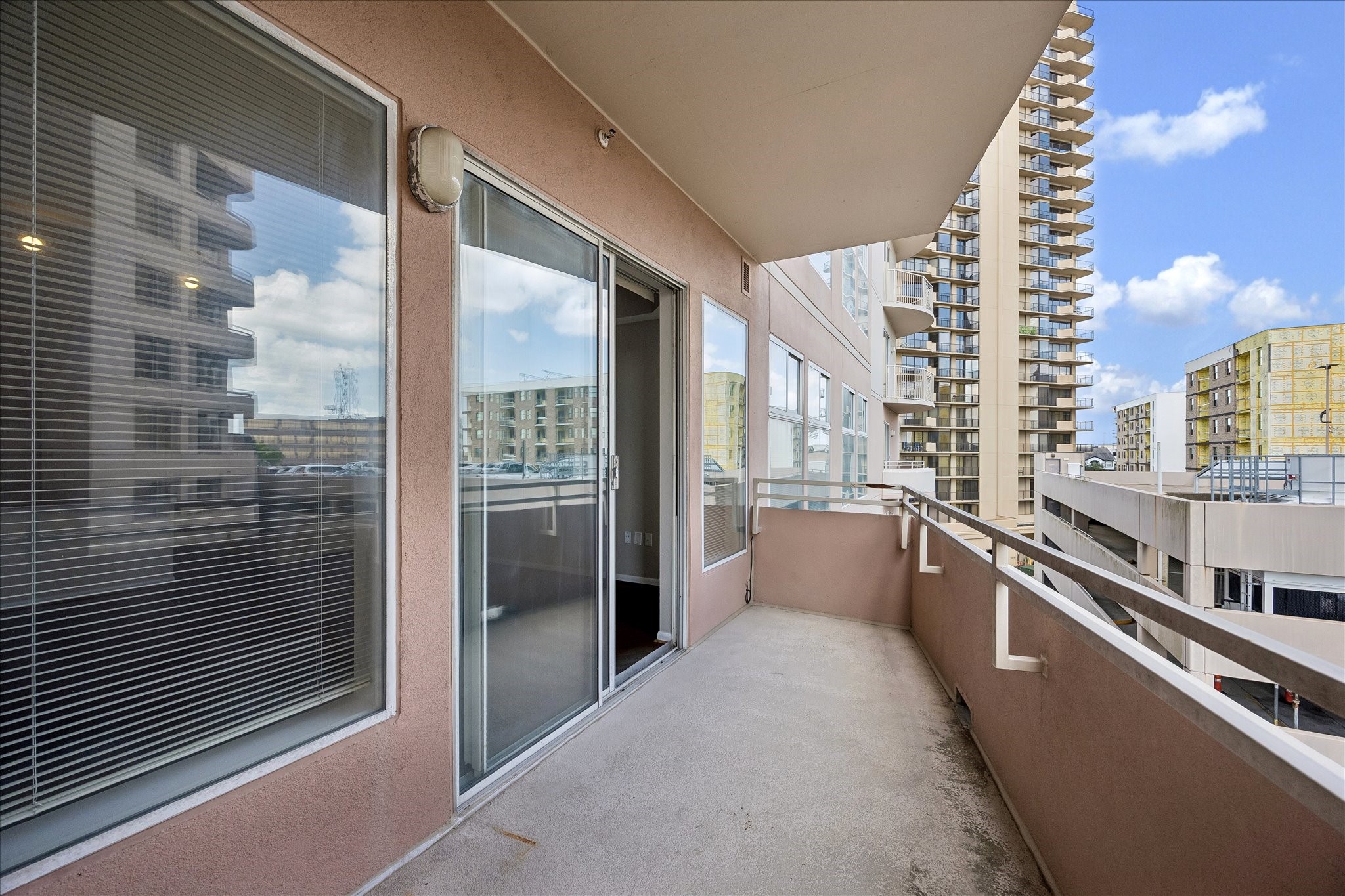 3505 Sage Road, Unit 508 Houston, TX 77056 - Photo 14 of 23 SOUTH FACING BALCONY HAS PATIO FLOOR AND LARGE WINDOWS WITH COVERINGS