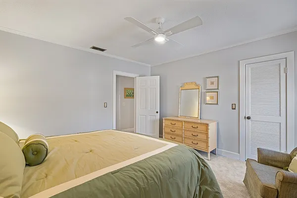 a bedroom with a bed and cabinets
