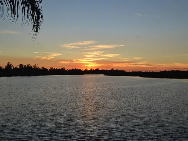 a view of lake and sunset