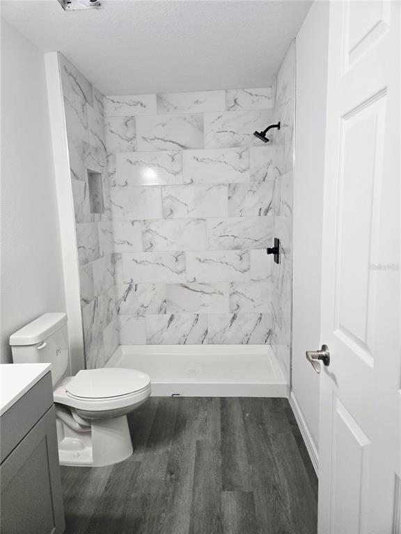 228 Juniper Loop Circle Ocala, FL 34480 - Photo 3 of 4 a bathroom with a toilet and a shower