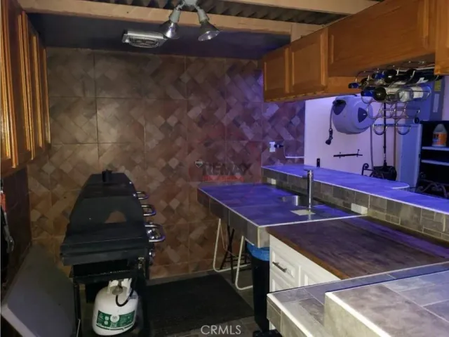 a bathroom with a sink mirror and toilet