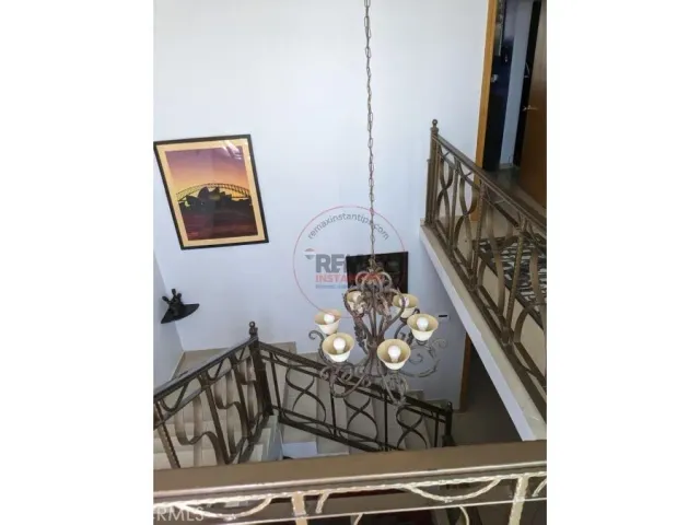 a bedroom with a bed and cabinets