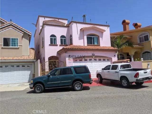 a view of a car parked in front of a house